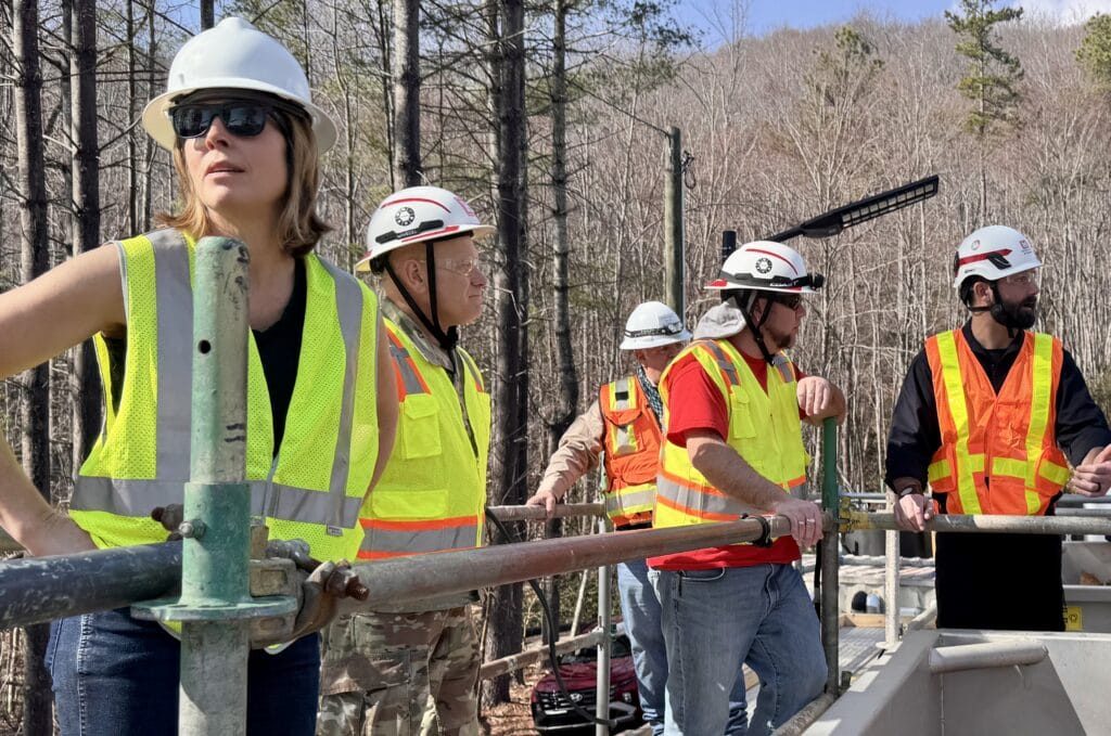 Esther Manheimer in a hard hat at a Hurricane Helene recovery site