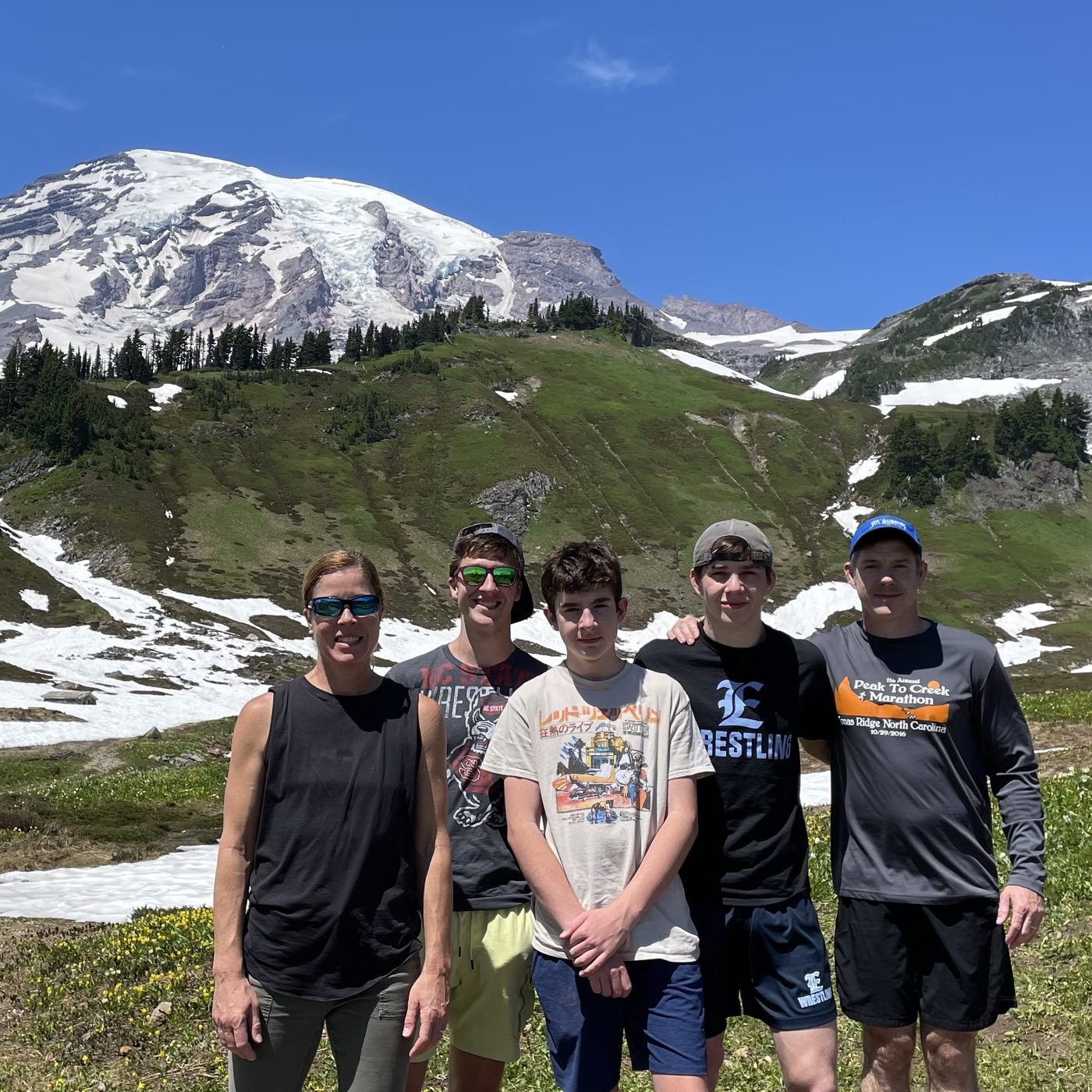 Esther, Mark and their three sons on a mountain hike