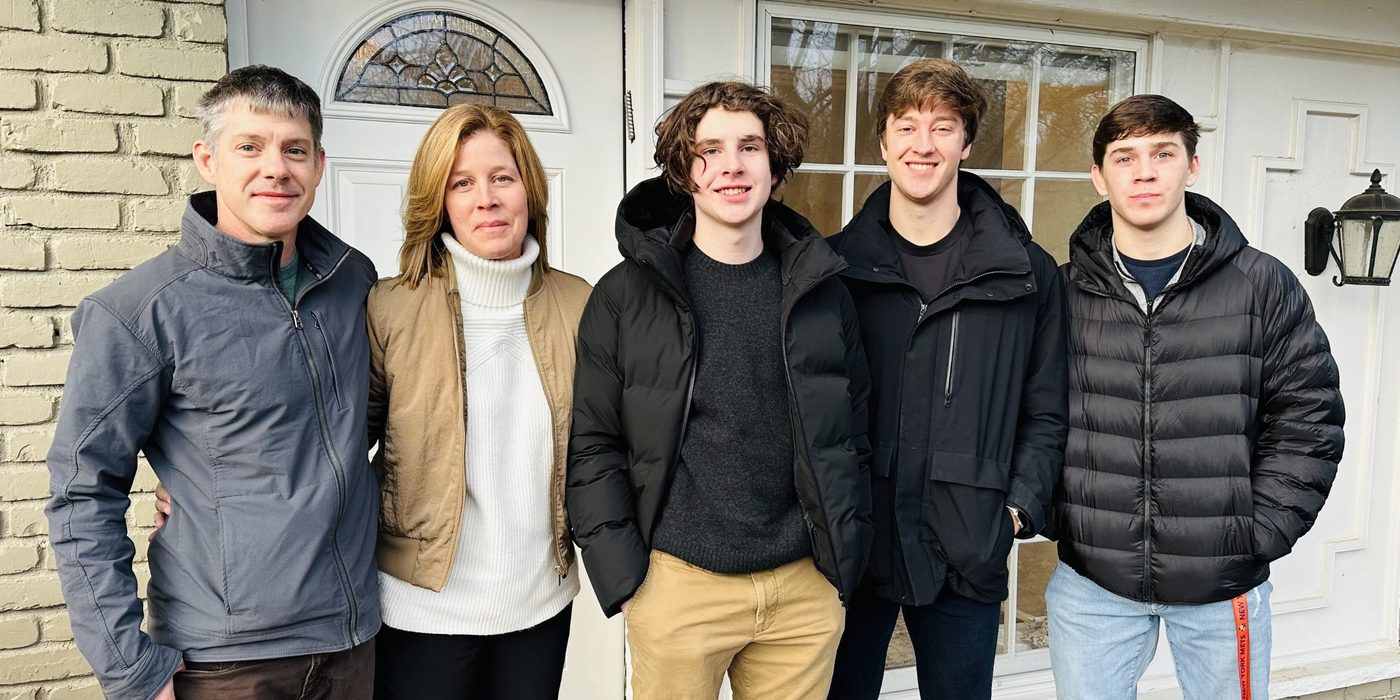 Esther, Mark and their three sons on the front porch, fall 2025